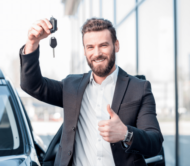 Man holding new Key - Car Key Replacement Chicago
