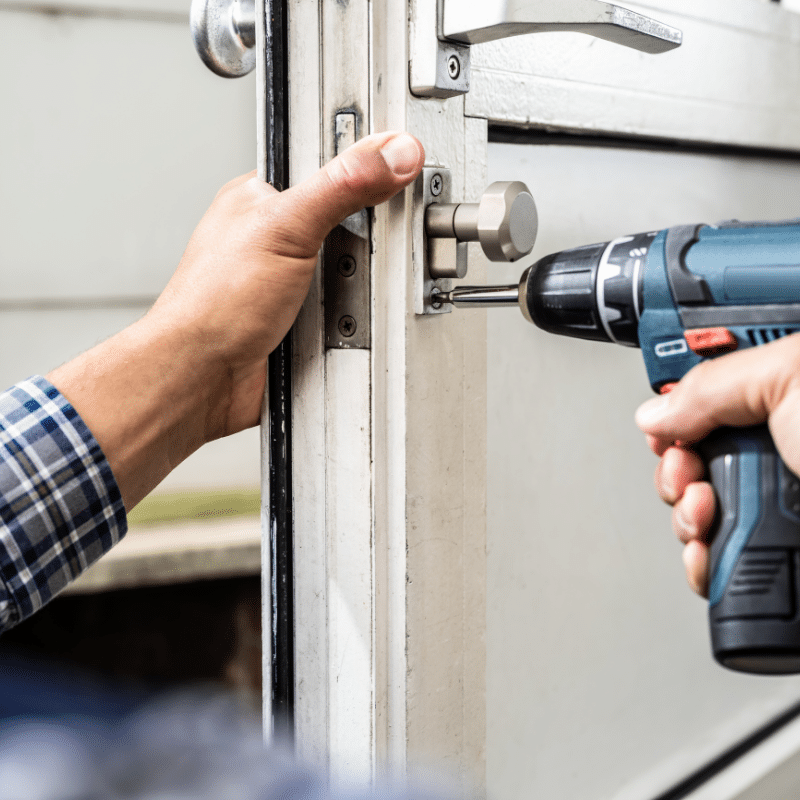 Man Changing House Door Lock - Lock change service